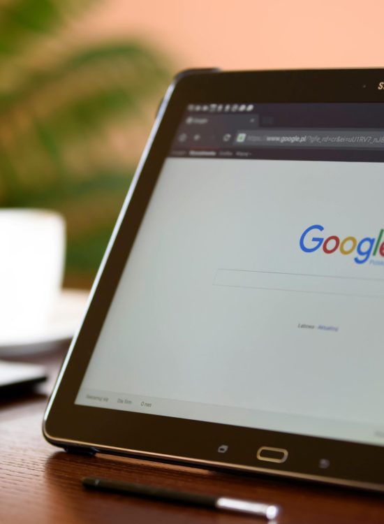 Samsung tablet on desk showing Google homepage, perfect for technology-related content.